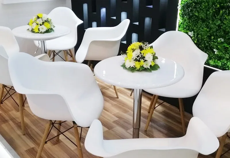White exhibition chairs and tables available for rental